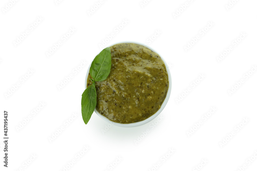 Fototapeta premium Bowl of Pesto sauce isolated on white background