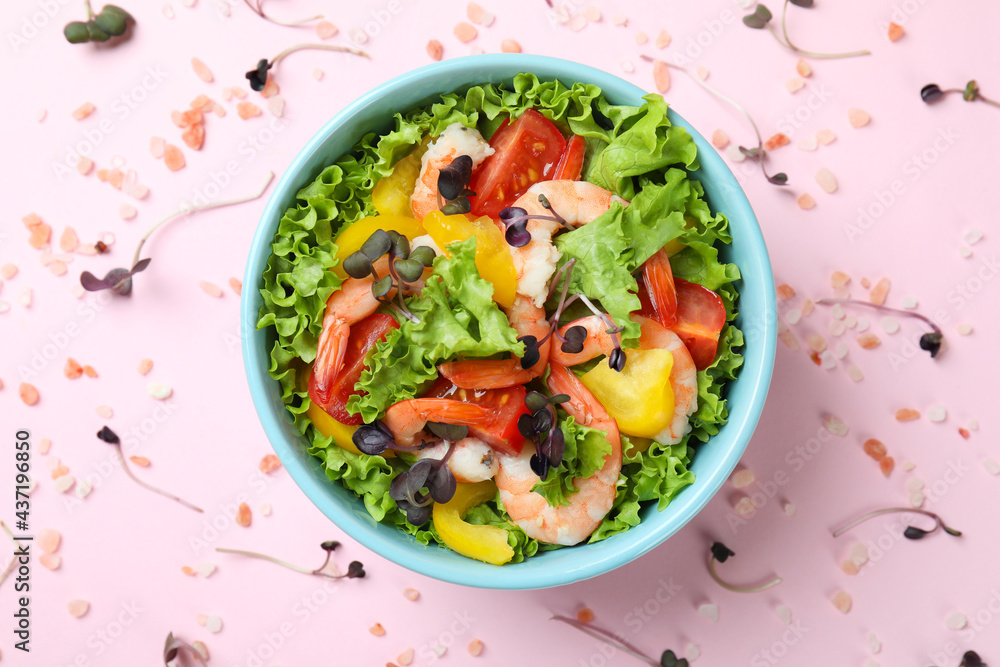 Concept of tasty eating with shrimp salad on pink background Concept of tasty eating with shrimp salad on pink background