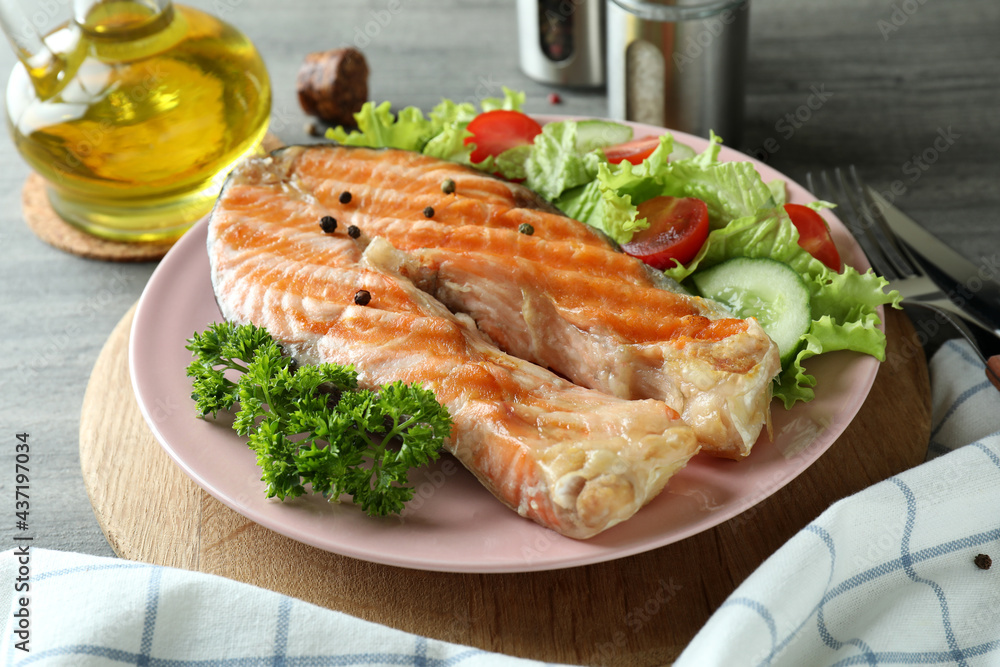 Concept of tasty eating with grilled salmon, close up Concept of tasty eating with grilled salmon, close up