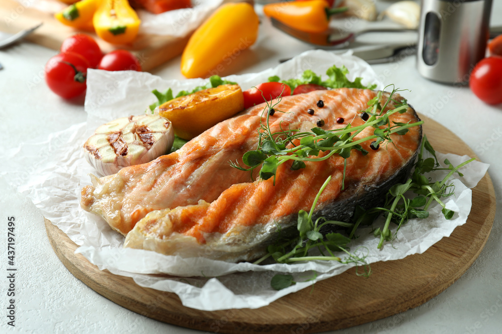 Concept of tasty eating with grilled salmon, close up Concept of tasty eating with grilled salmon, close up