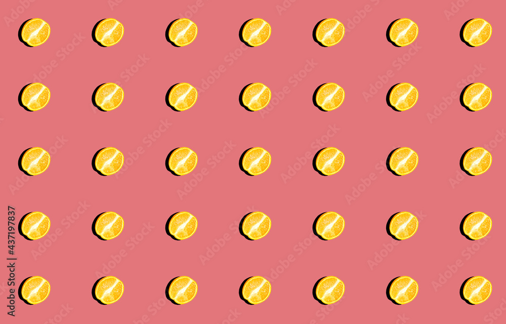 Pattern with fresh orange halves with a shadow on a pink background. Pattern with fresh orange halves with a shadow on a pink background.