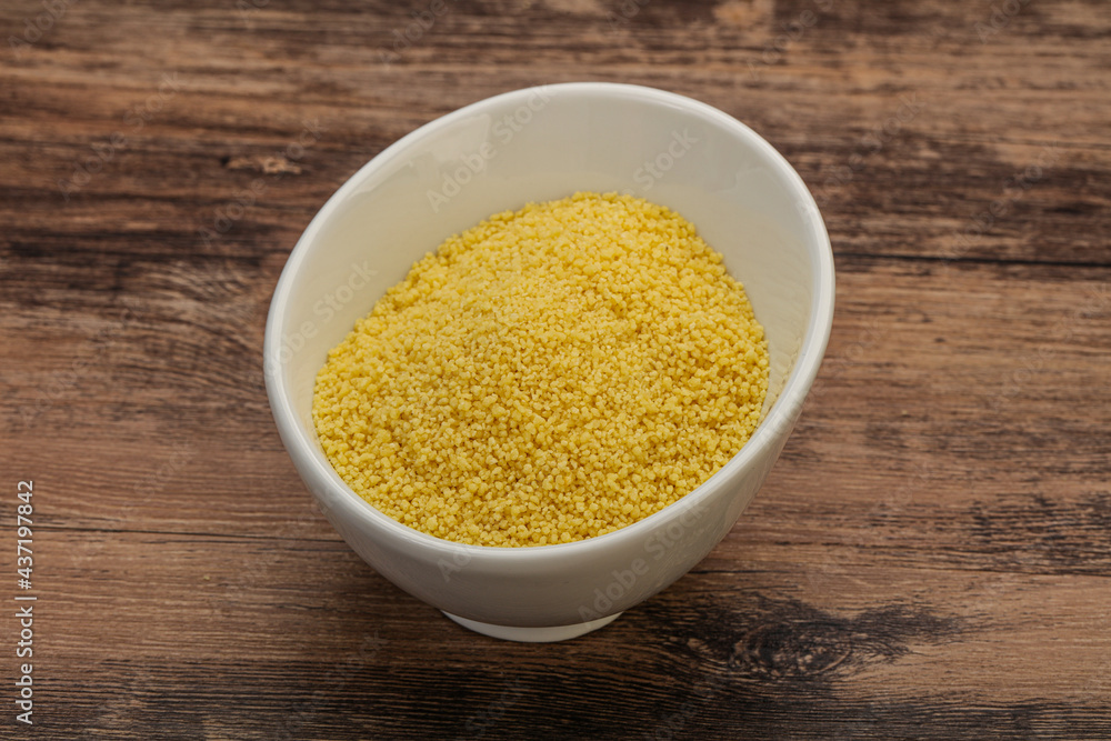 Raw cous cous heap in the bowl Raw cous cous heap in the bowl