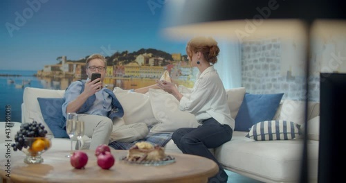 The footage was filmed in a purpose-built video studio scenery. Romantic story of a young family. Young and stylish man and woman on vacation by the sea.