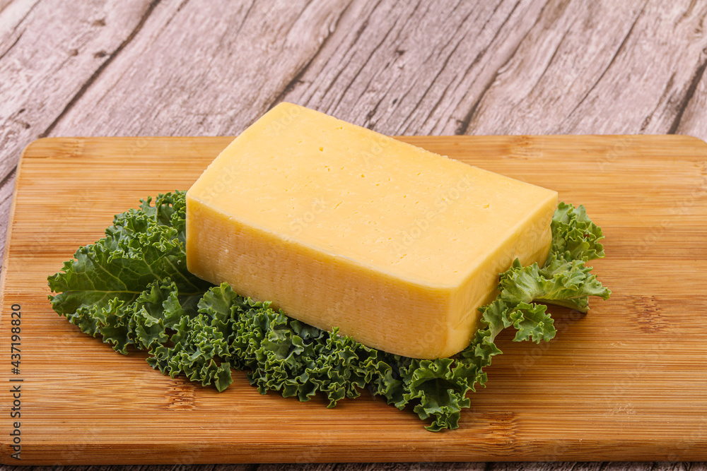 Tasty yelloow Tilsiter cheese brick