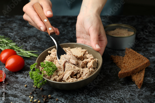 Bilde på lerret Concept of tasty eating with canned tuna on black smokey background