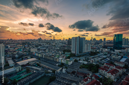 The blurred abstract background of the morning sun exposure to the tiny dust particles that surround the tall buildings in the capital  the long-term health issue of pollution.