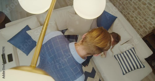 The footage was filmed in a purpose-built video studio scenery. Romantic story of a young family. Young and stylish man and woman on vacation by the sea.