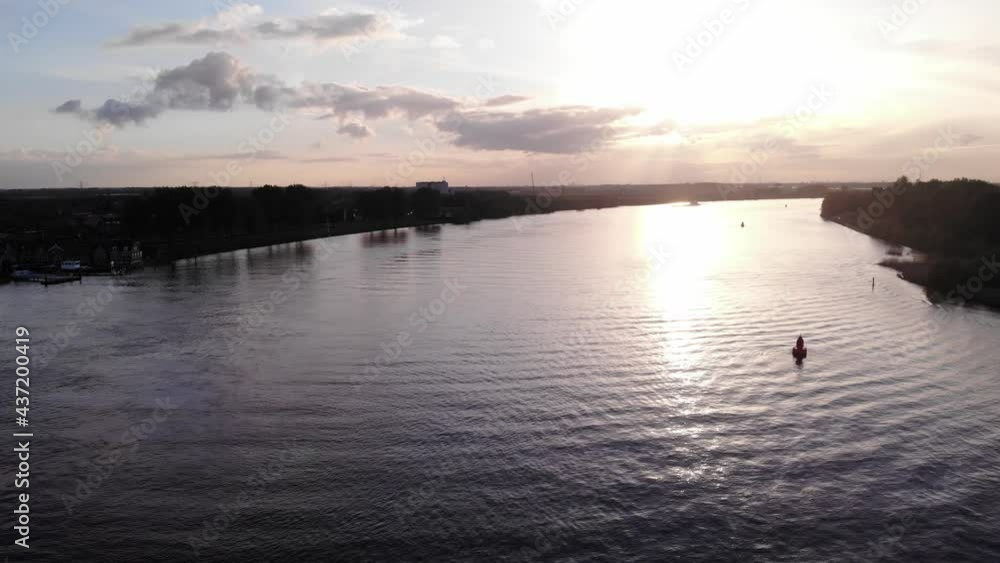 Bright Sunset Reflecting On Calm Water Of River. - aerial Bright Sunset Reflecting On Calm Water Of River. - aerial