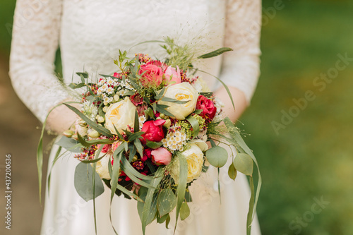wedding bouquet in the hand. Bride holds a bridal bouquet in her hand. Bridal bouquet 
