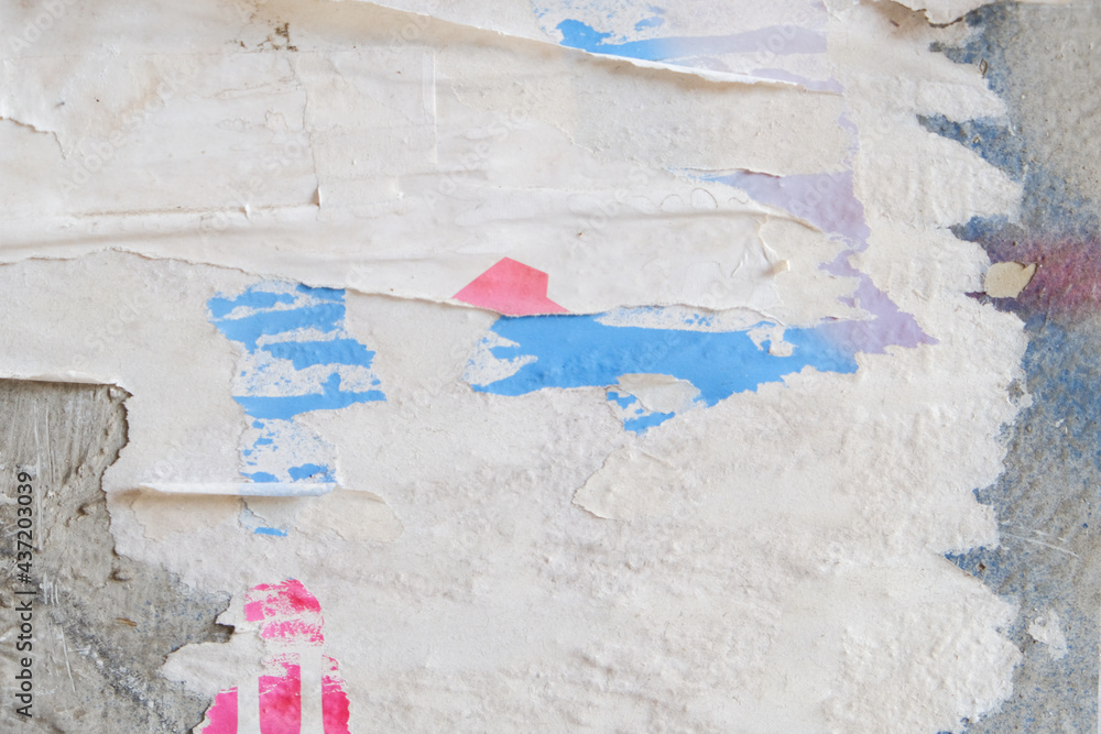 Fototapeta premium Torn vintage street poster background. Ripped paper abstract texture. Retro design.