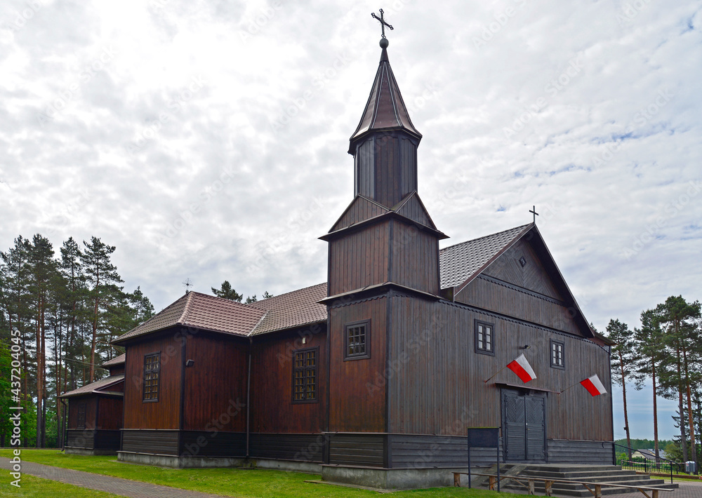 Built in 1925, a historic wooden Catholic church dedicated to Saint Roch in the village of Leman in Podlasie, Poland. There is also a historic wooden belfry next to the church. Built in 1925, a historic wooden Catholic church dedicated to Saint Roch in the village of Leman in Podlasie, Poland. There is also a historic wooden belfry next to the church.