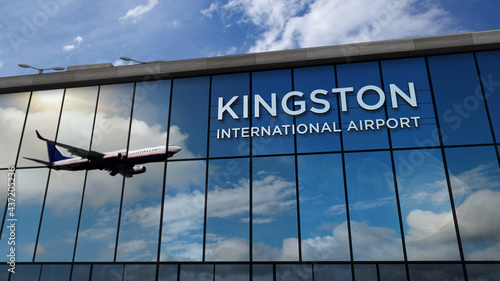 Airplane landing at Kingston Jamaica airport mirrored in terminal