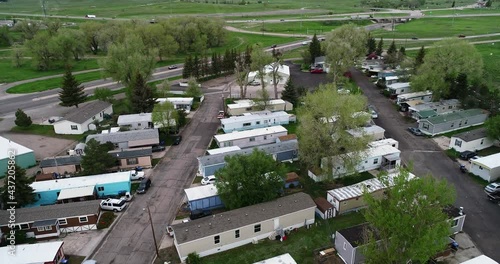 A poor neighborhood with mobile homes next to the highway. photo