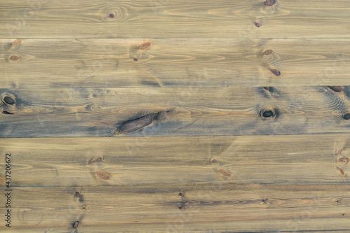 Wooden backdrop made of dark planks. Natural wood grain  knots.