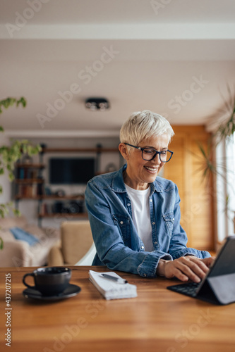 Senior woman, checking her e-mails.