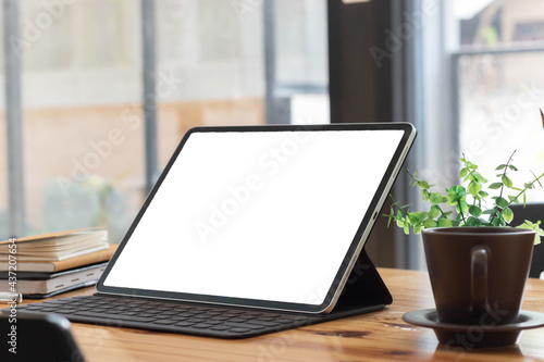 Close up view of comfortable office desk with laptop. photo