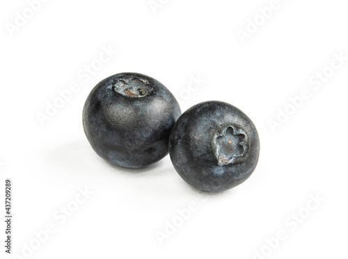 Two blueberries isolated on white background. Close-up