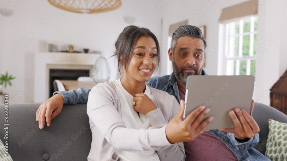 Happy multiethnic couple doing video call Happy multiethnic couple doing video call