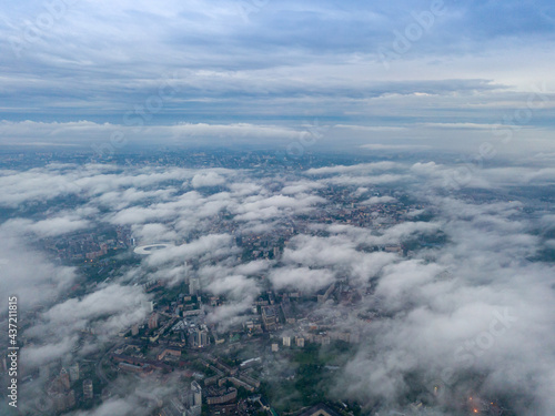 View of Kiev above the clouds at dawn. Aerial drone view. © Sergey