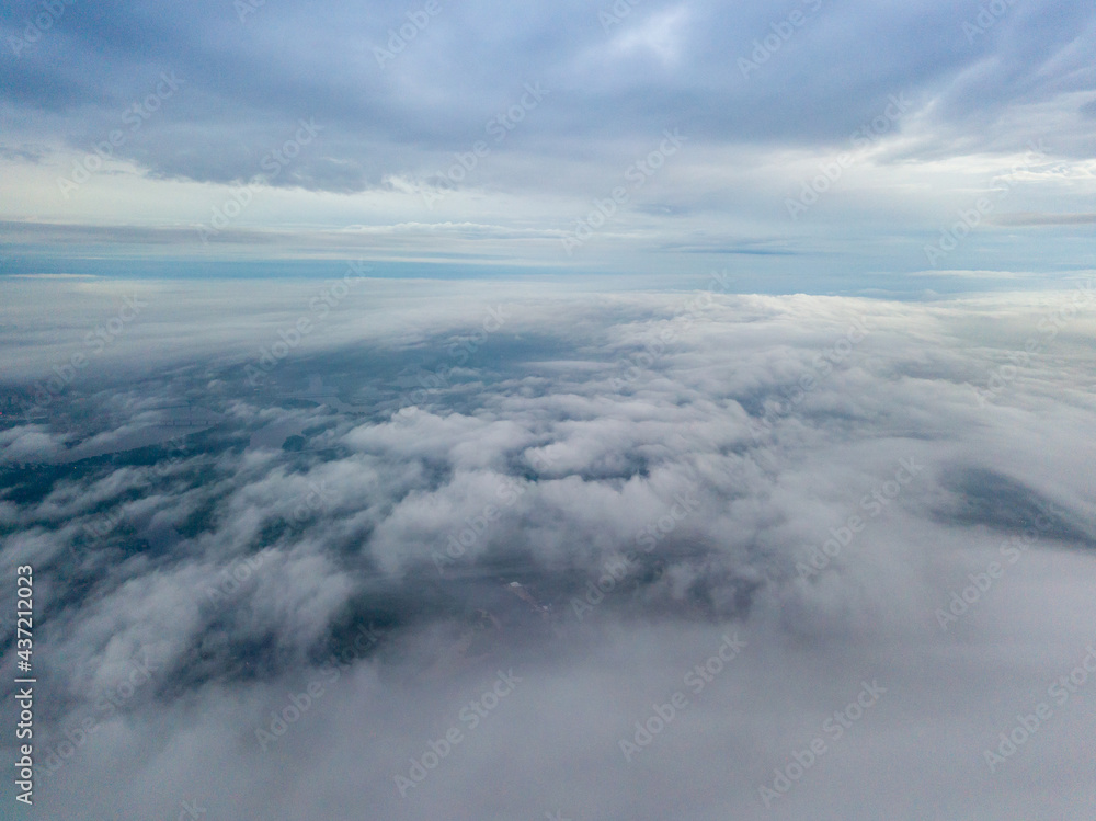 High view of the Dnieper River in Kiev. Aerial high flight above the clouds. High view of the Dnieper River in Kiev. Aerial high flight above the clouds.