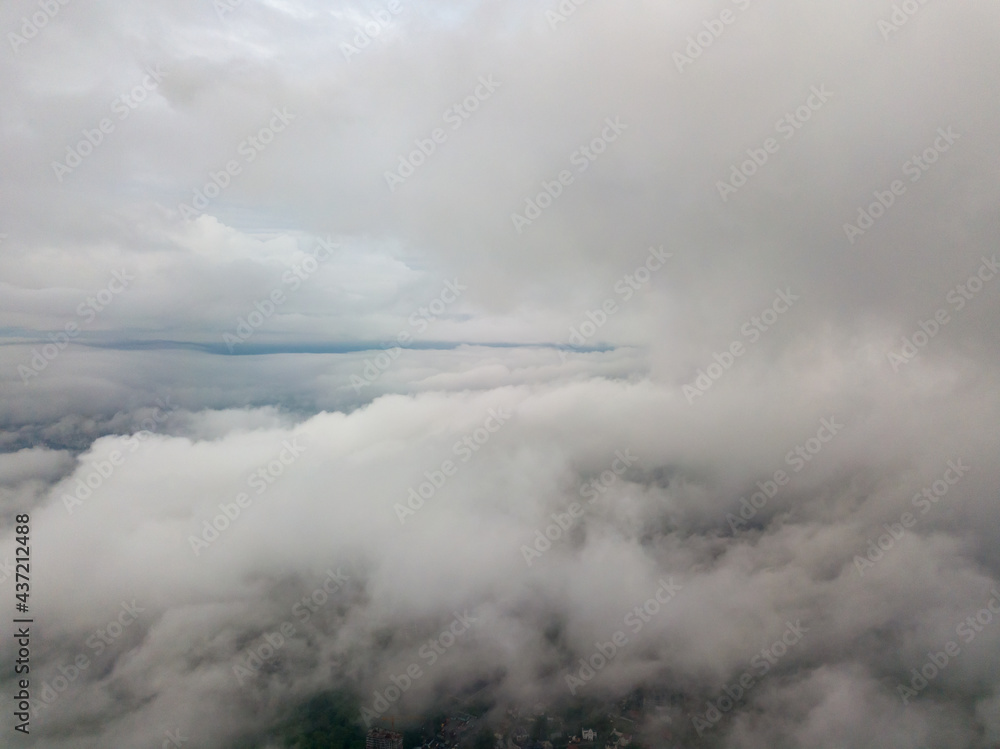 Fototapeta premium Aerial high flight above the clouds.