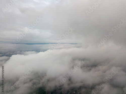 Aerial high flight above the clouds.