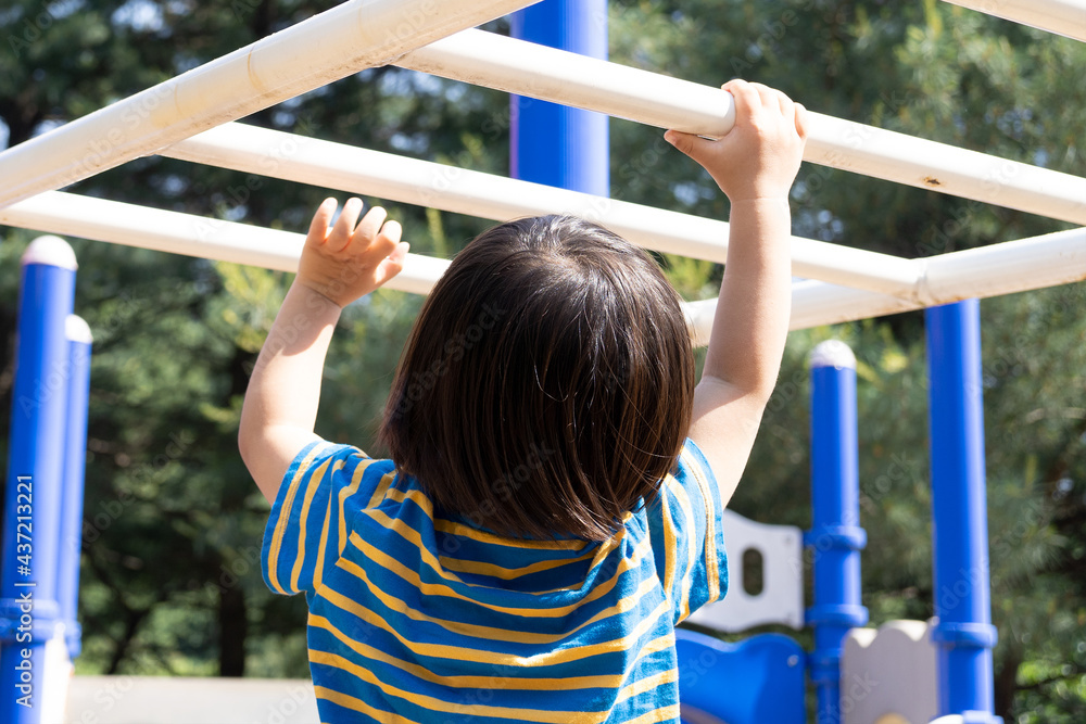 Fototapeta premium little child playing on playground