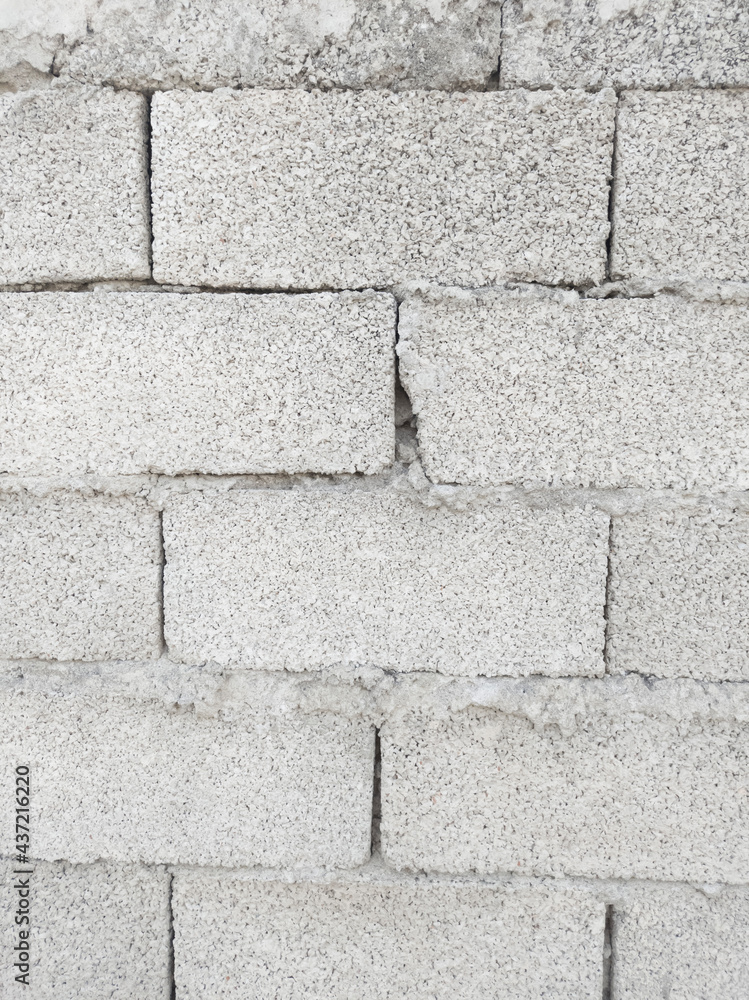 Fototapeta premium background old wall of large bricks cinder blocks close up