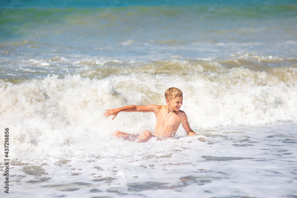 boy by the sea in a storm boy by the sea in a storm