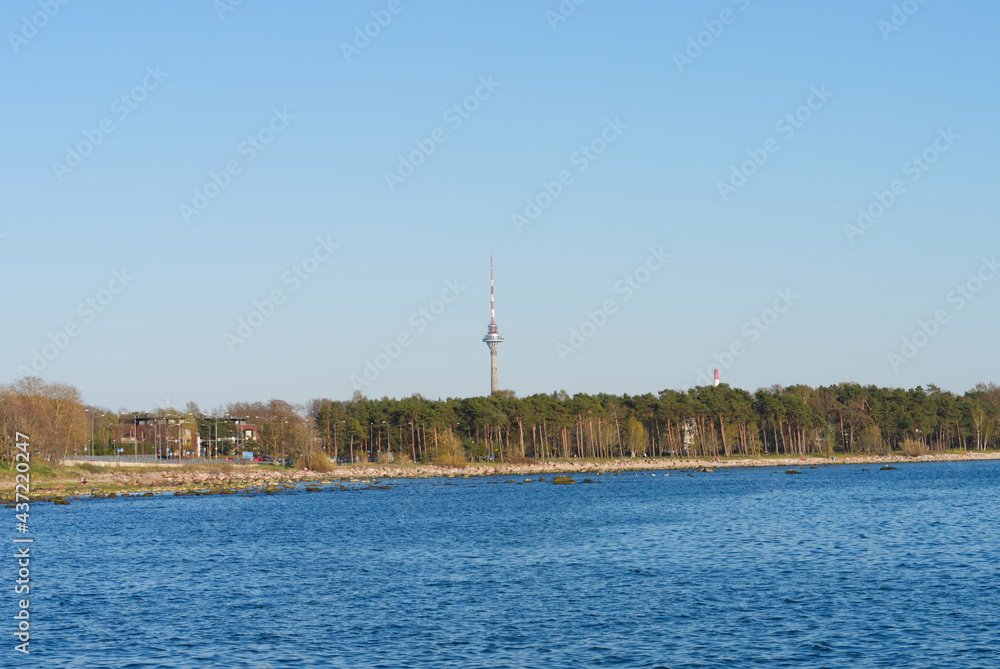 TV tower in Tallinn. View of the sea and forest, sunset TV tower in Tallinn. View of the sea and forest, sunset