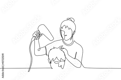 female barber dries hair with a hairdryer to a male client - one line drawing. woman barber styling the hair of the man