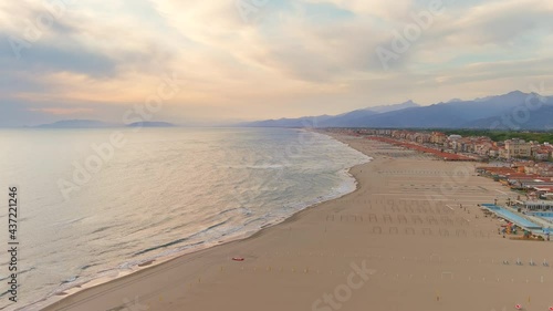 Viareggio, Italy - Aerial view of summer resort town in Tuscany, golden sand of famous beaches of Apuan Riviera and Versilia at sunset, colorful sky - landscape panorama of Europe from above - HDR photo
