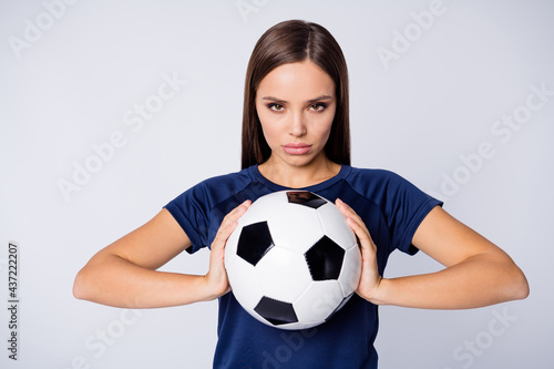 Close-up portrait of her she nice-looking attractive lovely pretty cute focused concentrated straight-haired girl holding in hands ball isolated on light white gray pastel color background © deagreez