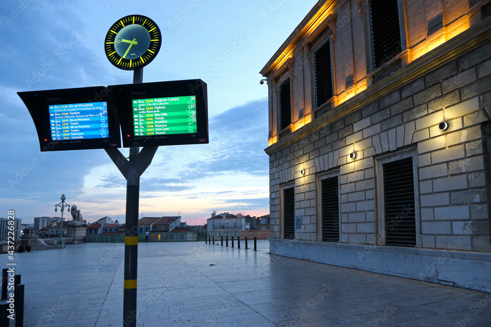 Information panel with train departures timetable near the building of Marseille Saint Charles railway station (Gare SNCF), main station of Marseille city, France