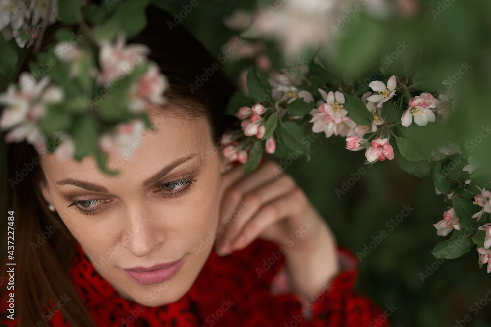 Portrait of a beautiful woman in the blooming garden Portrait of a beautiful woman in the blooming garden