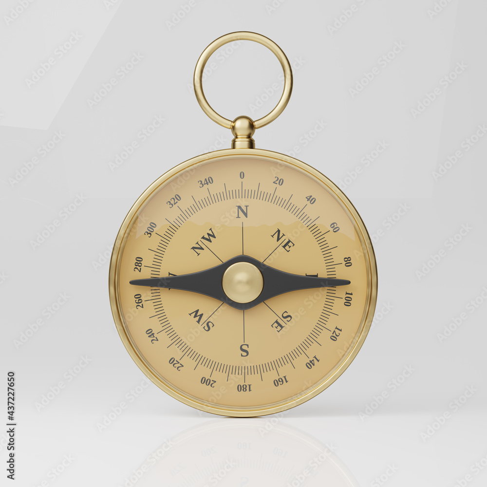 Golden classic round compass isolated on grey background