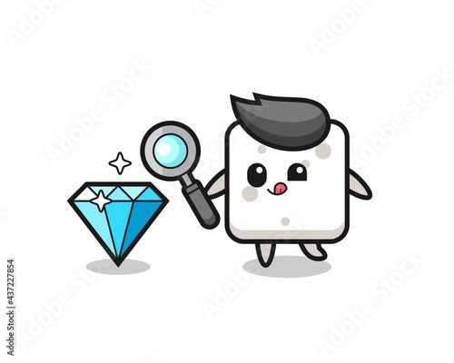 sugar cube mascot is checking the authenticity of a diamond