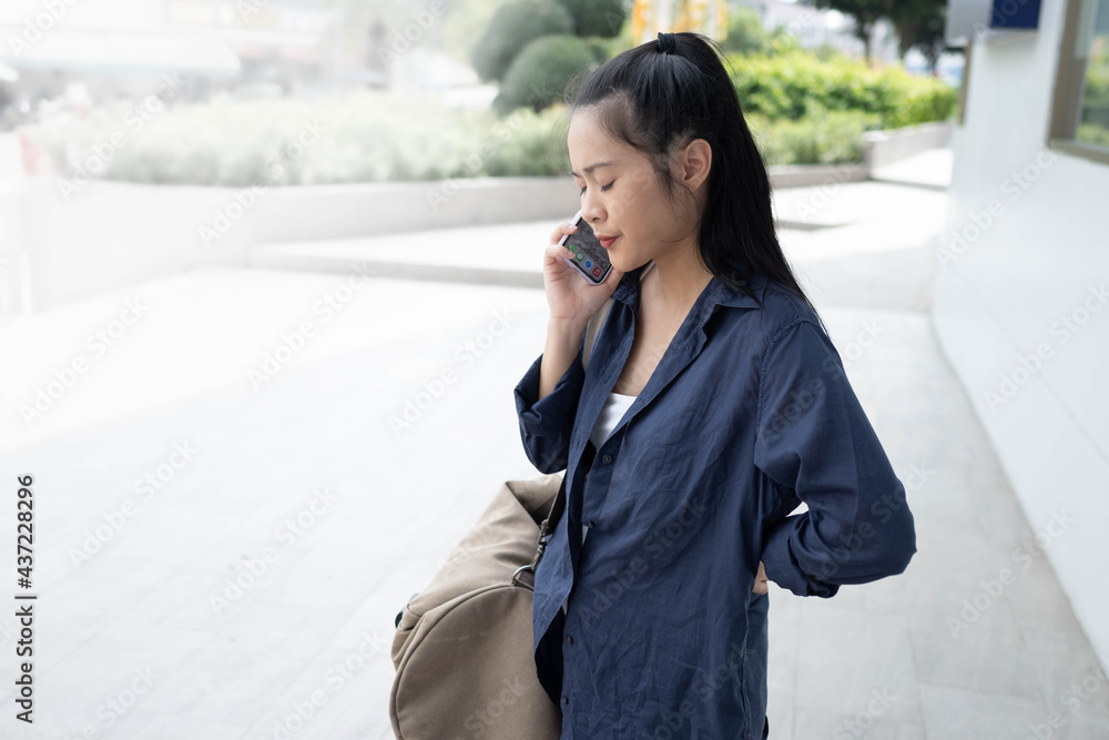 closeup Asian woman talk on the phone closeup Asian woman talk on the phone