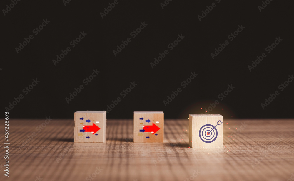 Goal and target, success and business target concept. Wood block on table with arrow icon about business strategy and Action plan. business development and copy space.