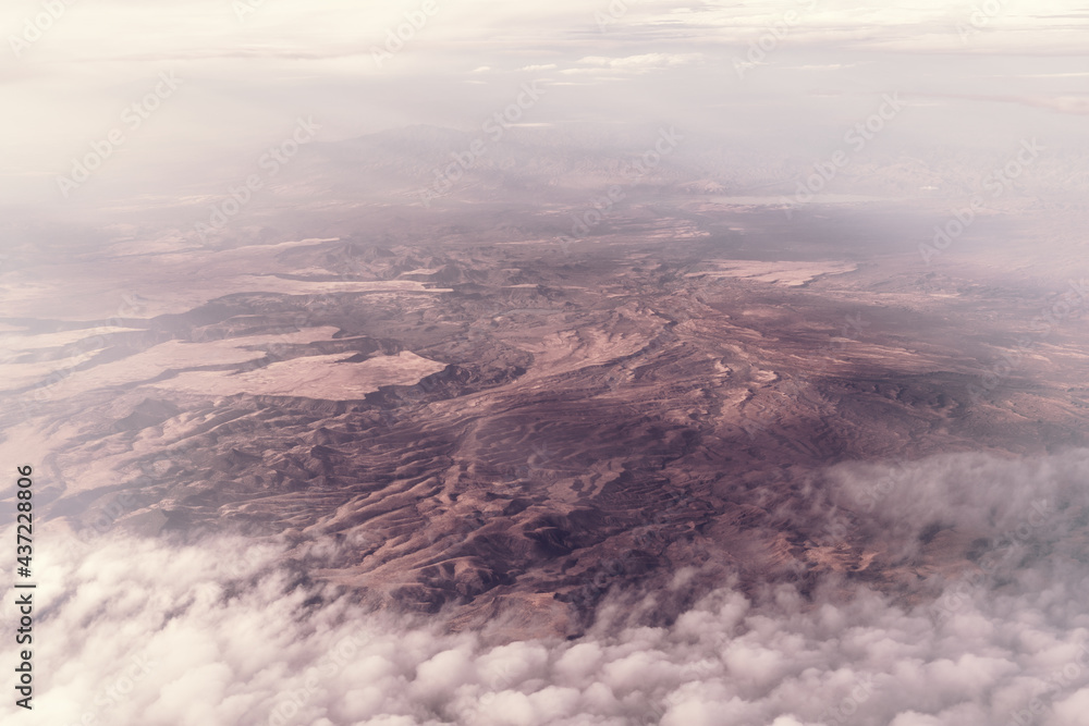 Fototapeta premium Aerial view of the Arizona desert. Clouds over the mountains near San Carlos, San Carlos Apache Indian Reservation, Gila County, east of Phoenix, AZ, USA.