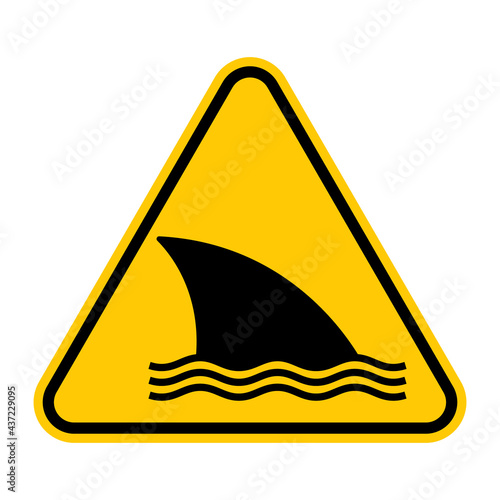 Shark warning sign. Vector illustration of yellow triangle sign with shark fin icon inside. Caution dangerous fish. Symbol used in beach. Entering the water is hazardous. Dangerous sea creature.