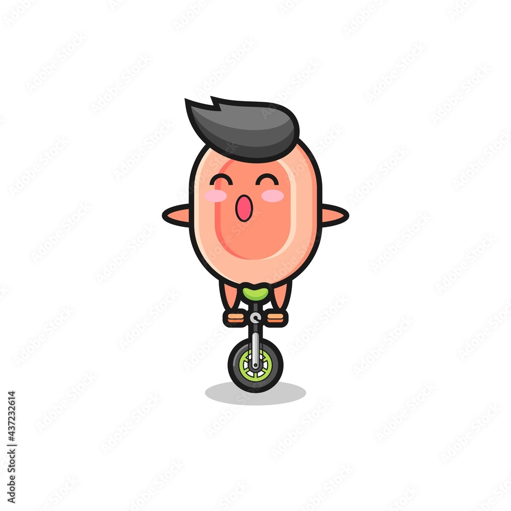 The cute soap character is riding a circus bike The cute soap character is riding a circus bike