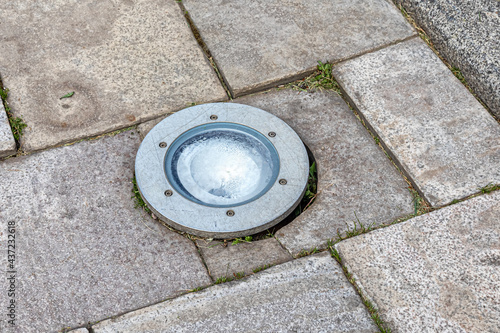 Floodlight built into paving slabs for lighting at night