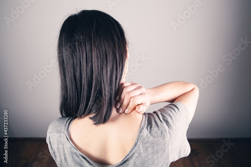 a young girl has a sore neck