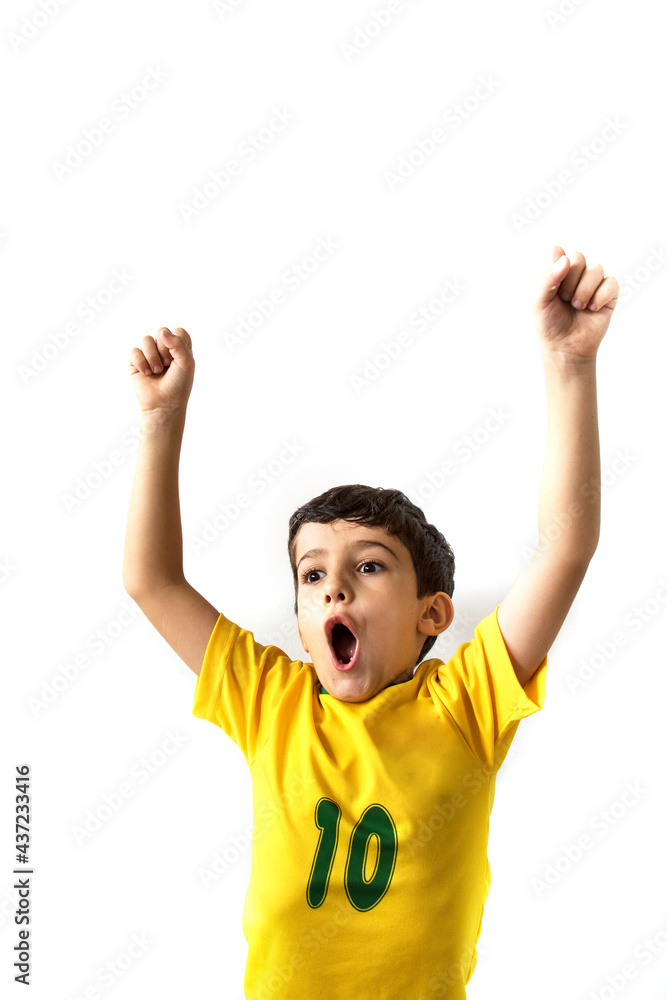 Brazilian boy, soccer player and fan, celebrates making a gesture with his hands over white background. Sports fan cherring. Brazilian boy, soccer player and fan, celebrates making a gesture with his hands over white background. Sports fan cherring.