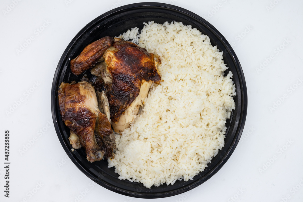 Bowl of Delicious Peruvian Chicken with Rice on a White Background Bowl of Delicious Peruvian Chicken with Rice on a White Background