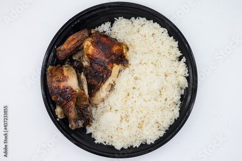 Bowl of Delicious Peruvian Chicken with Rice on a White Background