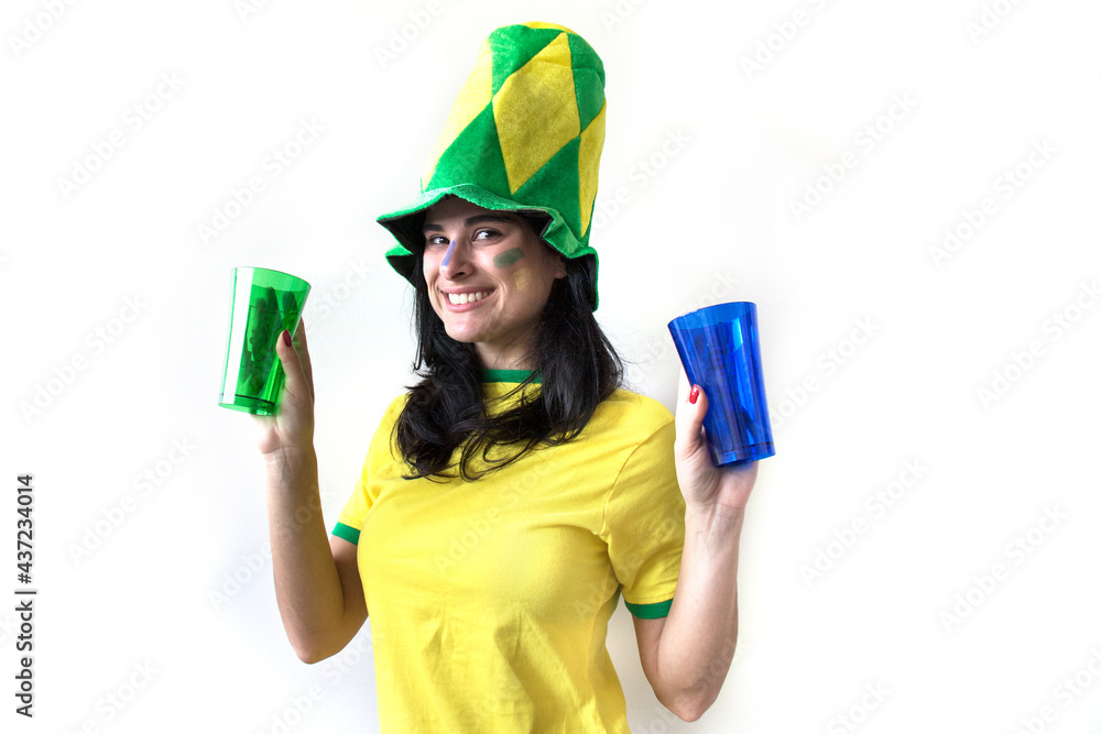 Sport fan Cherring. Beautiful brunette girl in yellow uniform. Woman celebrates sports and game over white background. Sport fan Cherring. Beautiful brunette girl in yellow uniform. Woman celebrates sports and game over white background.