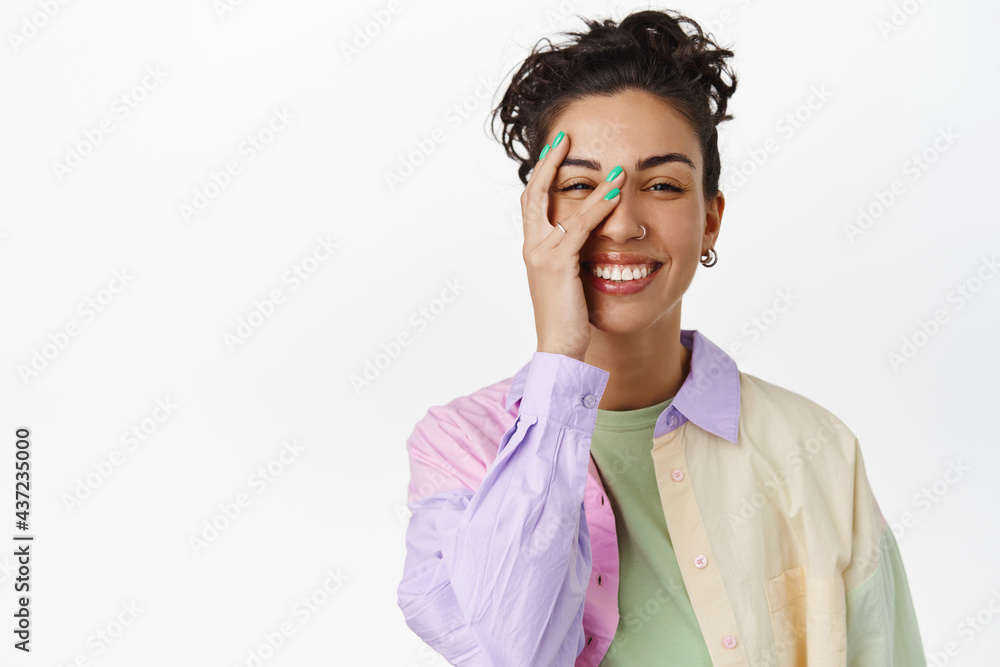 © Cookie Studio - Skin care and women concept. Beautiful young woman with natural no make up skin, touching pure clean face, smiling and laughing at camera, white background © Cookie Studio - Skin care and women concept. Beautiful young woman with natural no make up skin, touching pure clean face, smiling and laughing at camera, white background