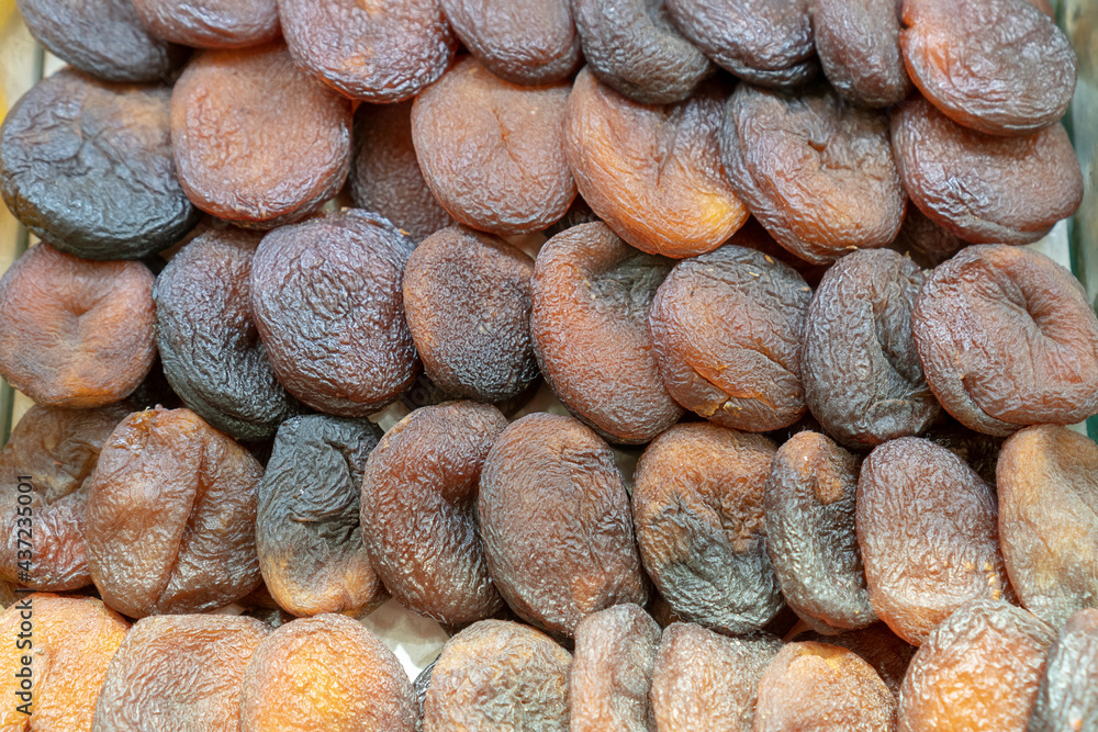 Dried raw apricots fruit background. Top view blur textures soft focus Dried raw apricots fruit background. Top view blur textures soft focus